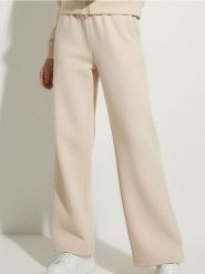 Spodnie dresowe wide leg - kremowy. Białe spodnie sportowe damskie Sinsay, l, z dresówki. Za 39.99 zł.