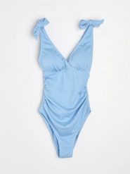 Jednoczęściowy ciążowy strój kąpielowy z marszczeniami - błękitny. Niebieskie stroje jednoczęściowe damskie Sinsay, l, bez wzorów, moda ciążowa. Za 69.99 zł.