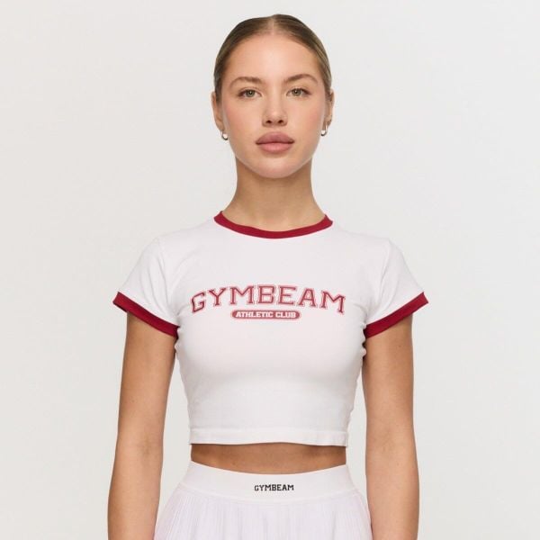 Koszulka damska fitness slim biała Varsity. Białe bluzki sportowe damskie GYMBEAM, l, bez wzorów, z elastanu, bez ramiączek. Za 88.90 zł.