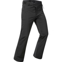 Spodnie narciarskie i snowboardowe męskie Quechua 500 softshell. Czarne spodnie materiałowe męskie WED'ZE, bez wzorów, z materiału, sportowe. Za 279.99 zł.