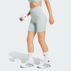 Krótkie legginsy Optimé Essentials Stash Pocket 7-Inch. Szare legginsy damskie Adidas, bez wzorów, z podwyższonym stanem, na fitness i siłownię. Za 149.00 zł.