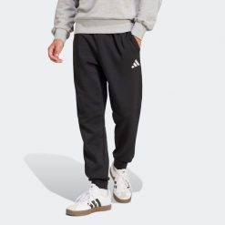 Second Life - Spodnie dresowe męskie ADIDAS Essentials Feelcozy - Stan Dobry. Czarne spodnie sportowe męskie Adidas, z bawełny. Za 164.99 zł.