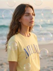 Bawełniana koszulka z napisem Miami - yellow jeans. Żółte t-shirty damskie Sinsay, l, bez wzorów, z bawełny, bez kołnierzyka. Za 25.99 zł.