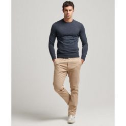 Sweter z wełny merynosów Superdry. Niebieskie swetry męskie Superdry., l, bez wzorów, z wełny, bez kołnierzyka. Za 326.40 zł.