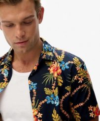 Superdry Koszula Hawaiian z nadrukiem, bawełna-modal. Niebieskie koszule damskie Superdry., m, bez wzorów, z bawełny, bez kołnierzyka, bez ramiączek. Za 279.65 zł.