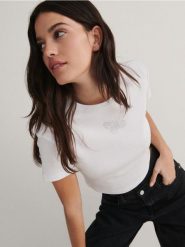 T-shirt z aplikacją - biały. Białe t-shirty damskie Reserved, l, z aplikacjami, z bawełny, bez kołnierzyka. W wyprzedaży za 19.99 zł.