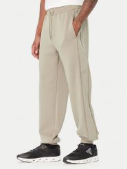 Guess Spodnie dresowe Z6BB03 K6544 Zielony Regular Fit. Zielone spodnie dresowe męskie Guess, z aplikacjami, z dresówki. Za 434.99 zł.