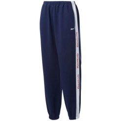 Spodnie damskie Reebok Te Linear Logo. Niebieskie spodnie materiałowe damskie Reebok, bez wzorów, z bawełny, klasyczne. Za 205.37 zł.