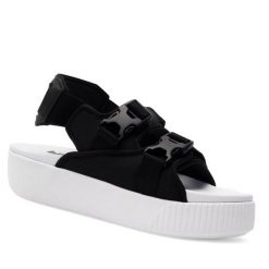 Sandały Puma. Czarne sandały damskie Puma, bez wzorów, bez obcasa, na koturnie. Za 229.99 zł.