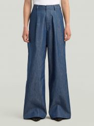 G-Star Spodnie w kolorze granatowym rozmiar: W30. Niebieskie spodnie materiałowe damskie G-Star, bez wzorów, z materiału, retro, z podwyższonym stanem. Za 288.52 zł.