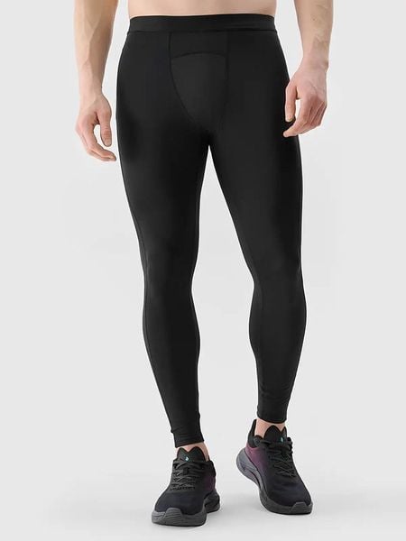 4F Legginsy funkcyjne w kolorze czarnym rozmiar: M. Czarne spodnie sportowe męskie 4f, z materiału. Za 58.14 zł.