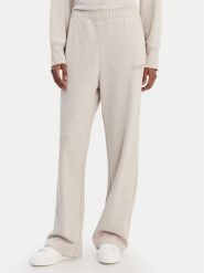 DKNY Sport Spodnie dresowe DP6P3795 Beżowy Regular Fit. Brązowe spodnie dresowe damskie DKNY Sport, l, z bawełny. Za 309.99 zł.