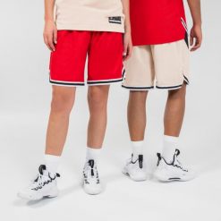 Dwustronne spodenki do koszykówki Tarmak SH500. Czerwone szorty męskie TARMAK, bez wzorów, z materiału, sportowe. Za 109.99 zł.