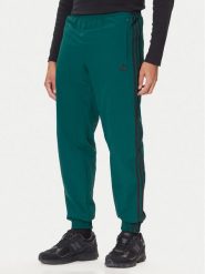 Adidas Spodnie dresowe adicolor Woven Firebird JY1335 Zielony Regular Fit. Zielone spodnie dresowe męskie Adidas, bez wzorów, z dresówki. Za 219.99 zł.