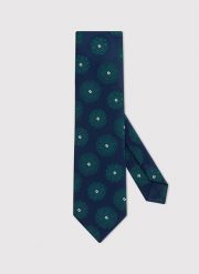 PAKO LORENTE – Granatowy krawat męski w zielone rozetki. Niebieskie krawaty i muchy męskie Pako Lorente, bez wzorów, z poliesteru. Za 69.99 zł.