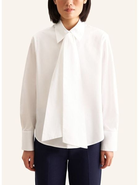 Seidensticker Bluzka w kolorze białym rozmiar: 44. Białe bluzki damskie Seidensticker, bez wzorów, z bawełny, bez kołnierzyka, bez ramiączek. Za 179.64 zł.