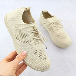 Buty sportowe damskie ażurowe beżowe News 1020. Brązowe buty sportowe na co dzień damskie NEWS, w ażurowe wzory, z tkaniny. Za 49.50 zł.