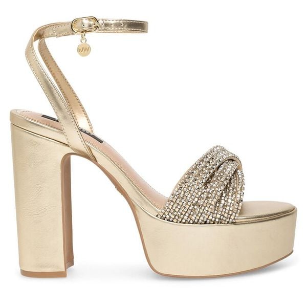 Sandały Nine West. Żółte sandały damskie Nine West, bez wzorów, bez obcasa, na słupku. Za 155.99 zł.