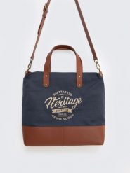 Torba unisex ze skórzanymi elemantami granatowo-brązowa Arvis 00. Brązowe shopper bag damskie Big Star, z aplikacjami, z lakierowanej skóry, przez ramię, duże, lakierowane, bez dodatków. W wyprzedaży za 299.99 zł.