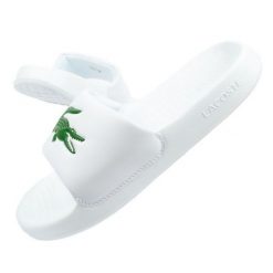 Klapki Lacoste Serve Slide W 02082 białe. Białe klapki damskie bez wzorów, z syntetyku, bez obcasa. Za 347.21 zł.