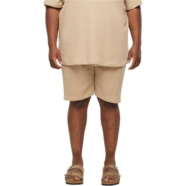 Szorty Urban Classics Waffle. Brązowe szorty męskie Urban Classics, bez kołnierzyka. Za 142.00 zł.