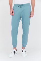 GUESS Turkusowe spodnie dresowe Aldwin. Niebieskie spodnie dresowe męskie Guess, z aplikacjami, z dresówki. W wyprzedaży za 229.99 zł.