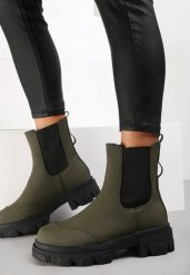 Zielone Botki Rhodima. Zielone botki damskie Renee, z nubiku, przed kolano, bez obcasa, na płaskiej podeszwie, bez zapięcia. Za 64.99 zł.