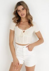 Jasnobeżowa Bluzka Amathamene. Brązowe bluzki damskie Born2be, xl, bez wzorów, z dzianiny, bez kołnierzyka, bez ramiączek. Za 29.99 zł.