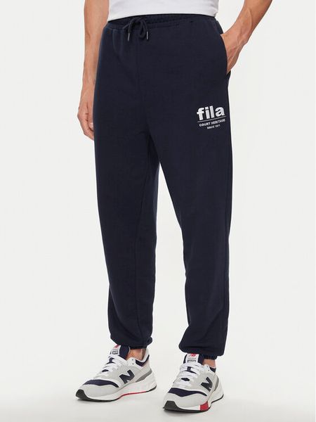 Fila Spodnie dresowe FAM0647 Granatowy Regular Fit. Niebieskie spodnie dresowe męskie Fila, bez wzorów, z bawełny. Za 139.99 zł.