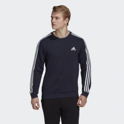 Bluza męska adidas Essentials Sweatshirt. Białe bluzy bez kaptura męskie Adidas, bez wzorów, sportowe, bez kołnierzyka, bez ramiączek. Za 199.00 zł.