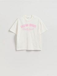 T-shirt z nadrukiem - złamana biel. T-shirty damskie Reserved, l, bez wzorów, z bawełny, bez kołnierzyka. Za 49.99 zł.