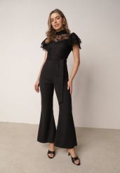 Czarny Elegancki Kombinezon VICES z Koronkową Górą i Rozszerzanymi Nogawkami Talinoe. Czarne kombinezony damskie Born2be, l, bez wzorów, z koronki, biznesowe, bez kołnierzyka, bez ramiączek. Za 199.99 zł.