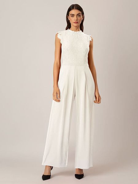 APART Kombinezon w kolorze białym rozmiar: 42. Białe kombinezony damskie Apart, bez wzorów, z koronki, bez kołnierzyka, bez ramiączek. Za 216.22 zł.