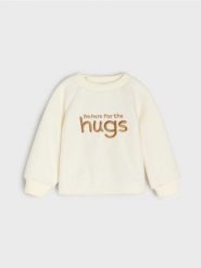 Welurowa bluza z haftowanym napisem - kremowy. Białe bluzy i bluzki niemowlęce Sinsay, bez wzorów, z weluru, bez ramiączek, bez kaptura. Za 15.99 zł.
