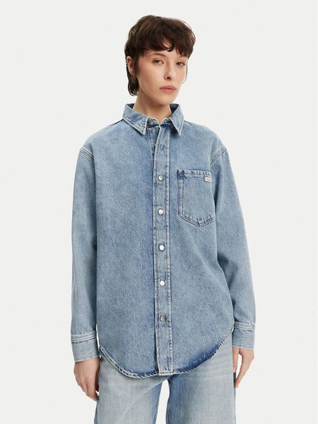 Calvin Klein Jeans Koszula jeansowa J20J225516 Niebieski Relaxed Fit. Niebieskie koszule damskie Calvin Klein Jeans, m, bez wzorów, z bawełny, bez kołnierzyka, bez ramiączek. Za 279.99 zł.