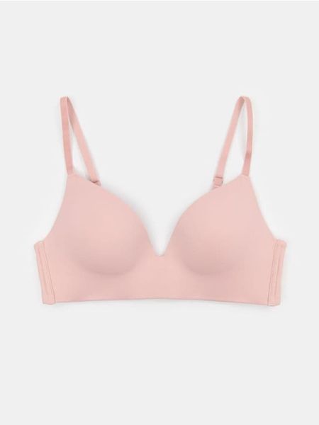 Bezfiszbiniowy biustonosz modelujący z formowanymi miseczkami - różowy. Czerwone biustonosze Sinsay, bez wzorów. Za 25.99 zł.