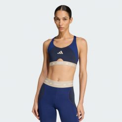 Biustonosz treningowy TECHFIT Color Block zapewniający średnie wsparcie. Czarne biustonosze sportowe damskie Adidas, bez wzorów, z elastanu. Za 219.00 zł.