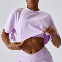 Crop top sportowy do treningu Ansje. Niebieskie topy sportowe damskie Intica, s, bez wzorów, z materiału, bez ramiączek. Za 119.00 zł.