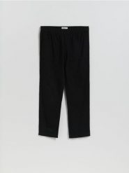 Bawełniane spodnie jogger - czarny. Czarne spodnie materiałowe męskie Reserved, bez wzorów, z bawełny. Za 119.99 zł.