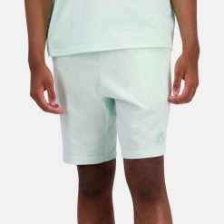 Spodnie Le Coq Sportif Model Bas Short Nº1 Kolor Zielony. Zielone spodnie materiałowe męskie Le Coq Sportif, bez wzorów, z materiału, eleganckie. Za 270.50 zł.