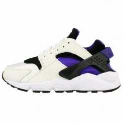 Buty do chodzenia damskie Nike Air Huarache. Białe obuwie do biegania damskie Nike. Za 510.45 zł.