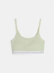 Bawełniany sportowy biustonosz typu top - zielony. Zielone biustonosze sportowe damskie Sinsay, bez wzorów, z bawełny. Za 14.99 zł.