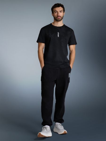 4F T-shirt regular z nadrukiem męski - czarny L. Czarne t-shirty męskie 4f, l, bez wzorów, bez kołnierzyka. Za 79.99 zł.