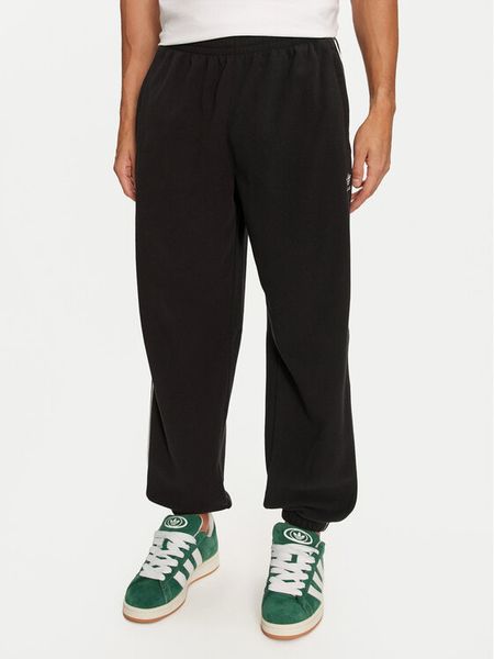 Adidas Spodnie dresowe adicolor 3-Stripes IZ4798 Czarny Regular Fit. Czarne spodnie dresowe męskie Adidas, bez wzorów, z dresówki. Za 189.99 zł.