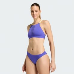 ZESTAW BIKINI RIPSTREAM Z KRZYŻUJĄCYMI SIĘ REGULOWANYMI RAMIĄCZKAMI. Fioletowe bikini damskie Adidas, bez wzorów. Za 219.00 zł.