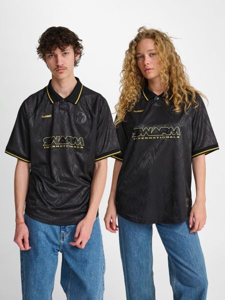 Koszulka Hummel Loose. Czarne bluzki sportowe damskie HUMMEL, s, z elastanu, bez kołnierzyka, bez ramiączek. Za 245.35 zł.