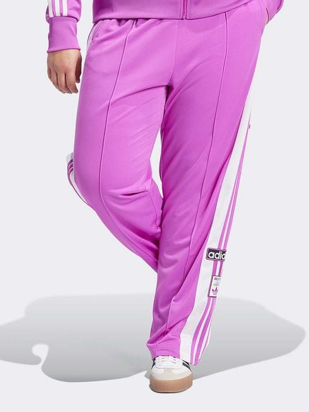Adidas Spodnie dresowe w kolorze różowo-białym rozmiar: 2X. Białe spodnie dresowe damskie Adidas, bez wzorów, z dresówki. Za 262.45 zł.