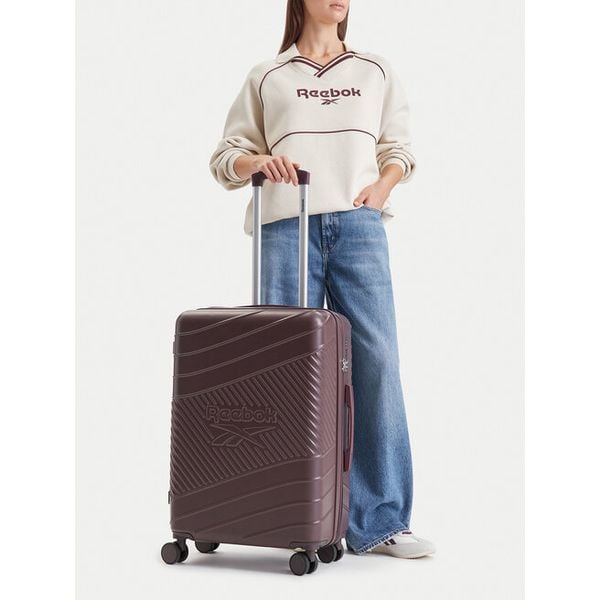 Walizka średnia Reebok. Fioletowe walizki Reebok, bez wzorów, średnie. Za 269.99 zł.
