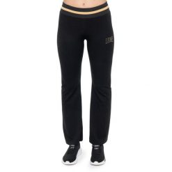 Wąż zimowy Leone 1947 Damen Schlaghose z Goldnieten. Czarne spodnie dresowe damskie LEONE 1947 APPAREL, na zimę, bez wzorów, z lycry. W wyprzedaży za 132.85 zł.