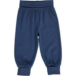 Spodnie w kolorze granatowym. Niebieskie spodnie niemowlęce Lamino, bez wzorów, z materiału. W wyprzedaży za 35.95 zł.